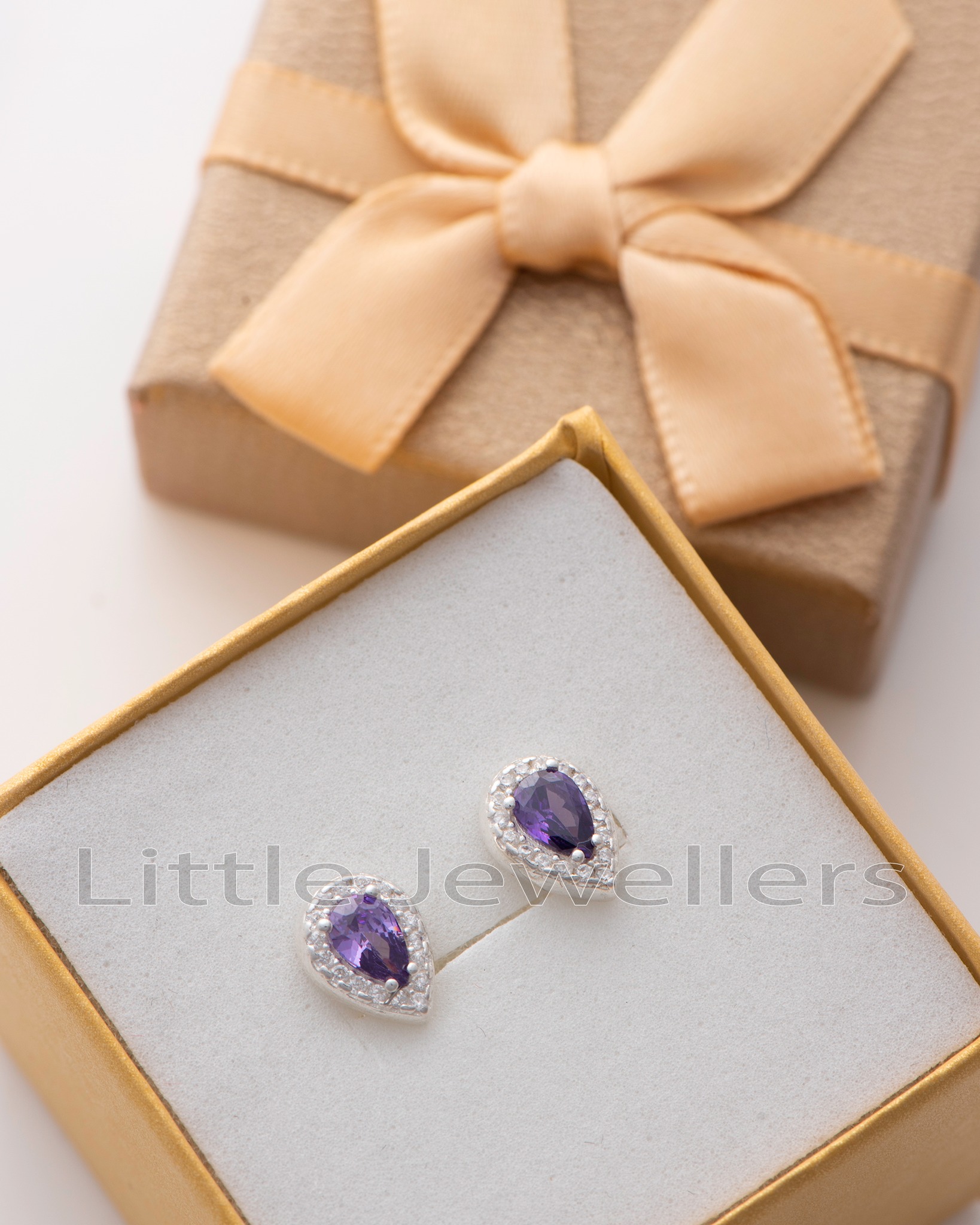Shop beautiful sterling silver stud earrings with clear & amethyst zirconia stones. Find your perfect pair in Nairobi - timeless style & elegance for any occasion.
