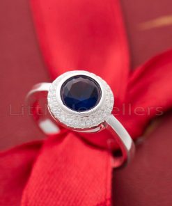 Indulge your special lady with our stunning sapphire blue ring. Crafted with elegance in mind, this hypoallergenic sterling silver piece exudes grace and sophistication