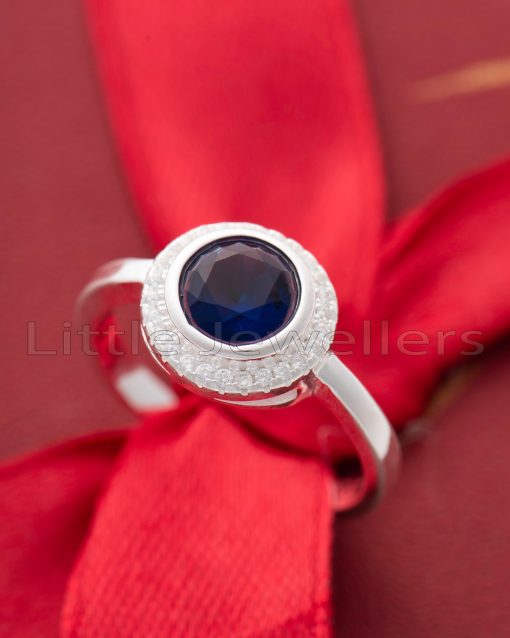Indulge your special lady with our stunning sapphire blue ring. Crafted with elegance in mind, this hypoallergenic sterling silver piece exudes grace and sophistication