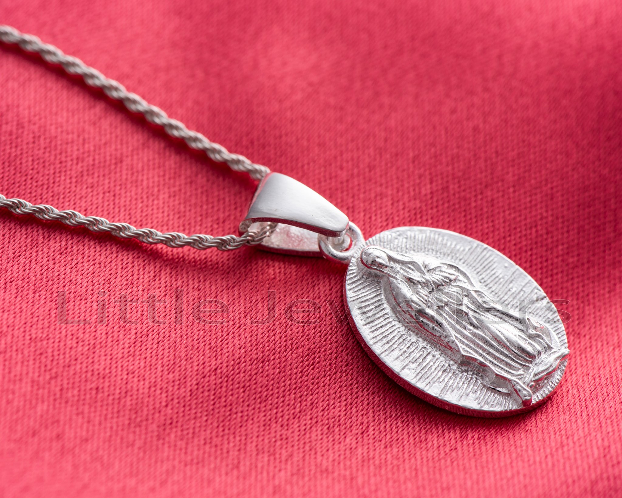 This high-quality sterling silver necklace with a Virgin Mary pendant ...